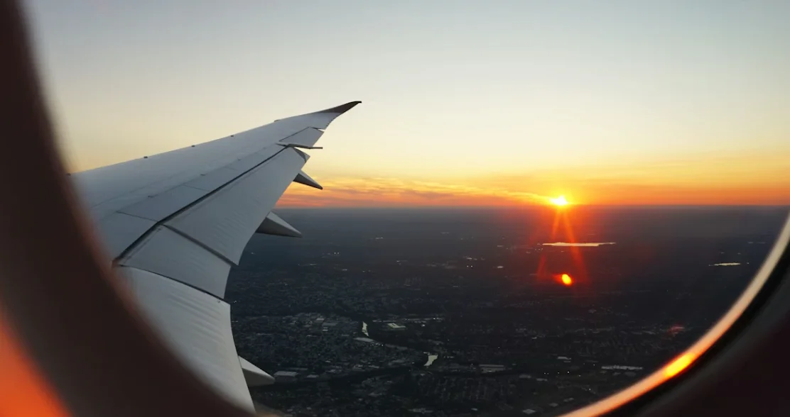 Airplane-wing-during-sunset-flight