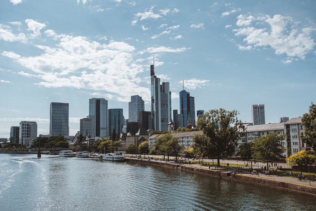 A Body Of Water With A City In The Background