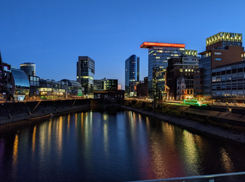 A Body Of Water With Buildings Along