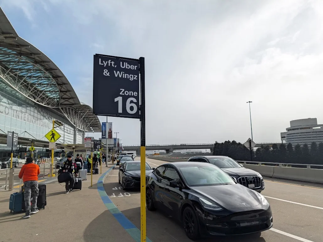 A Car Parked In Front Of An Airport