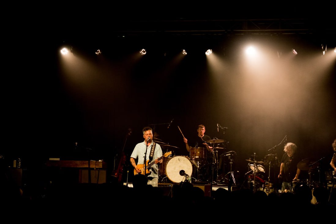 A Group Of People That Are On A Stage
