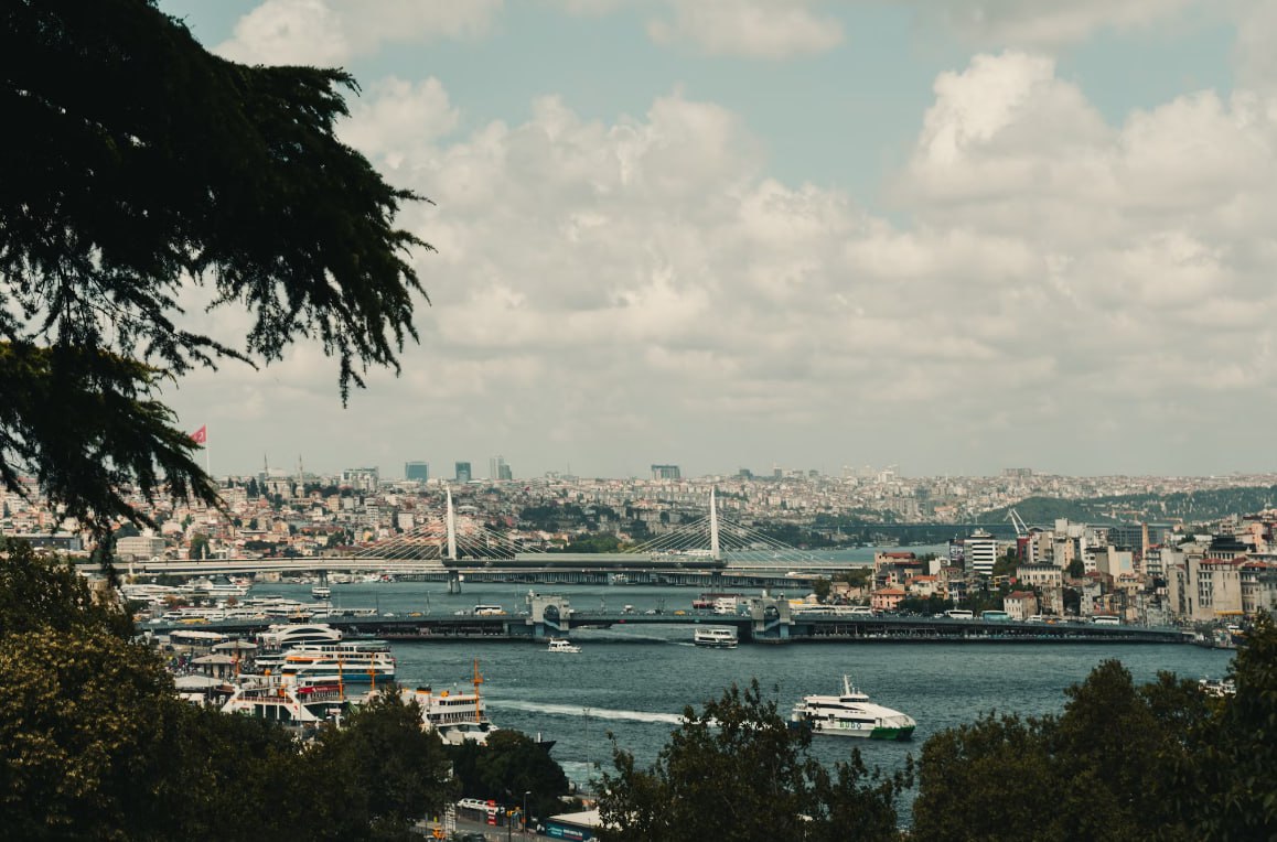 A Harbor Filled With Lots Of Boats Next To A City
