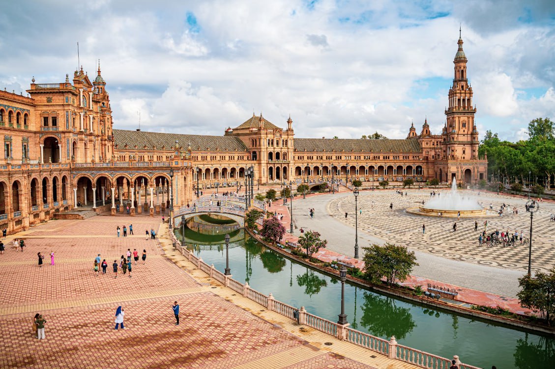 A Large Building With A Fountain In Front