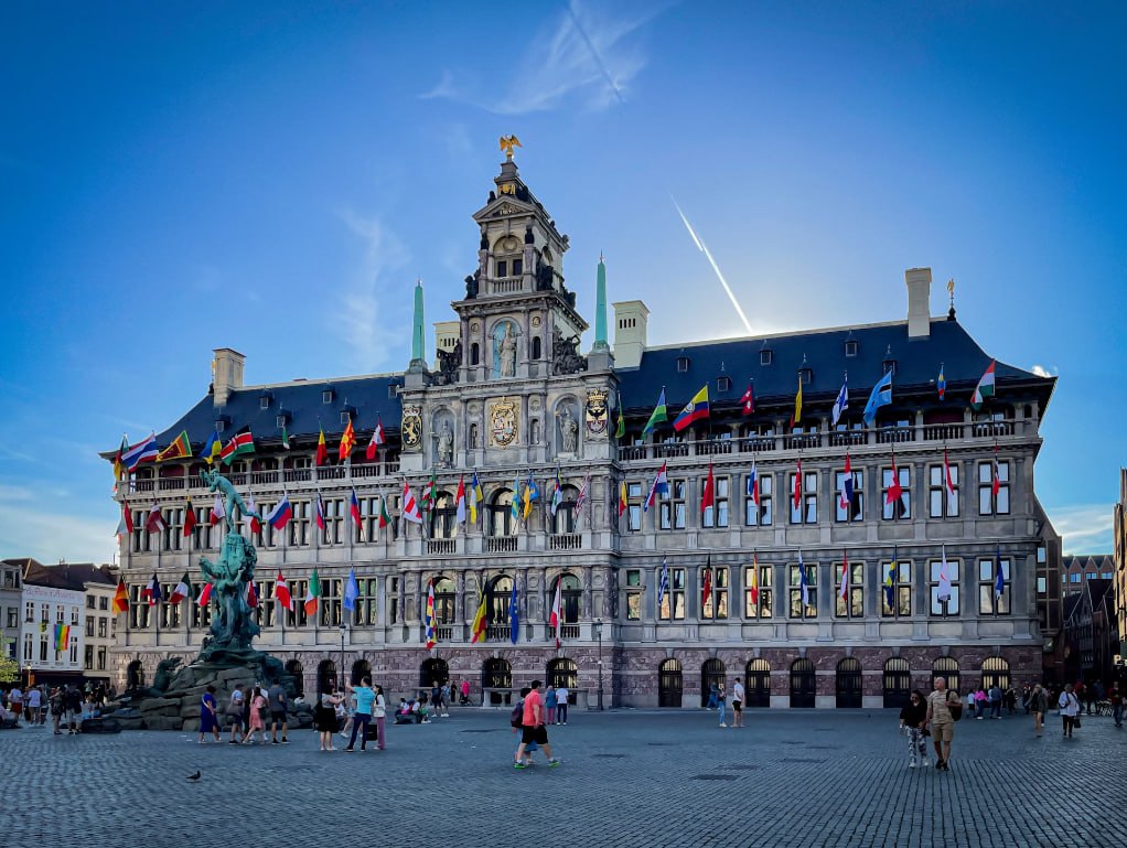 A Large Building With A Statue In Front Of It