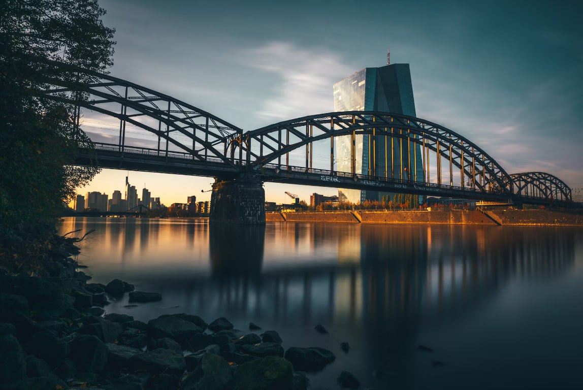 A Train Crossing A Bridge Over A Body Of Water