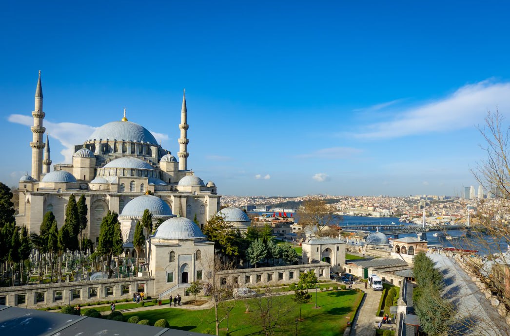 A View Of A Large White Building With Many Spires