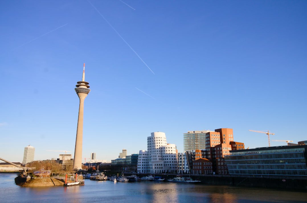 A View Of A River With A Tower In The Background