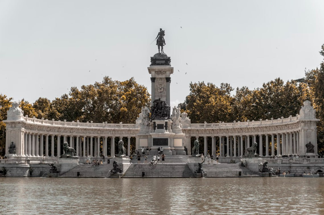 Black Statue Near Water During Daytime Od