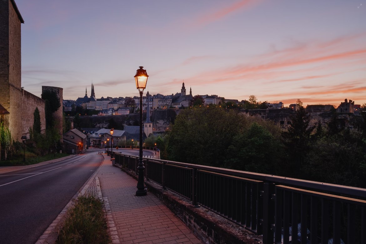 Black-Street-Lamp-Near-Black-Metal-Fence-During-Sunset