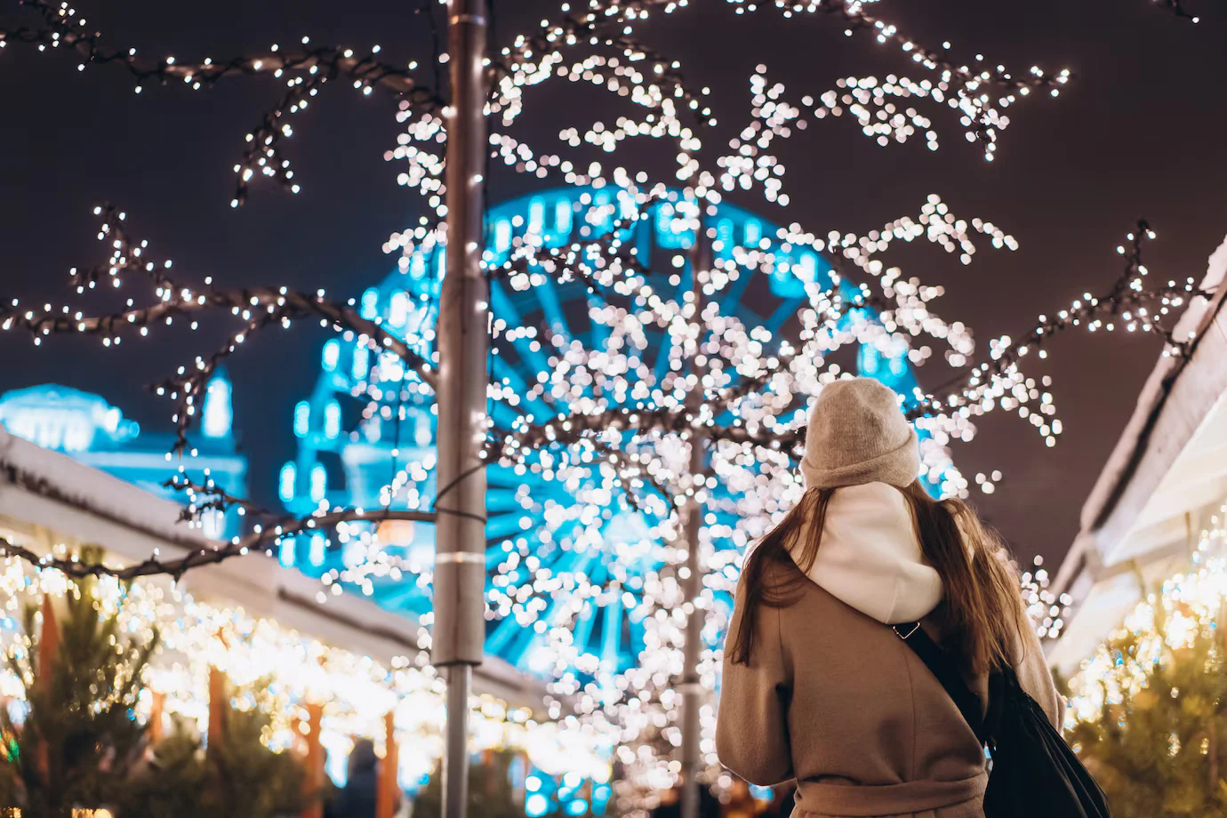 girl_posing_against_the_background_of_decorated_trees