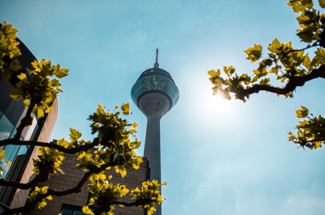 Green And White Tower Under Blue Sky During