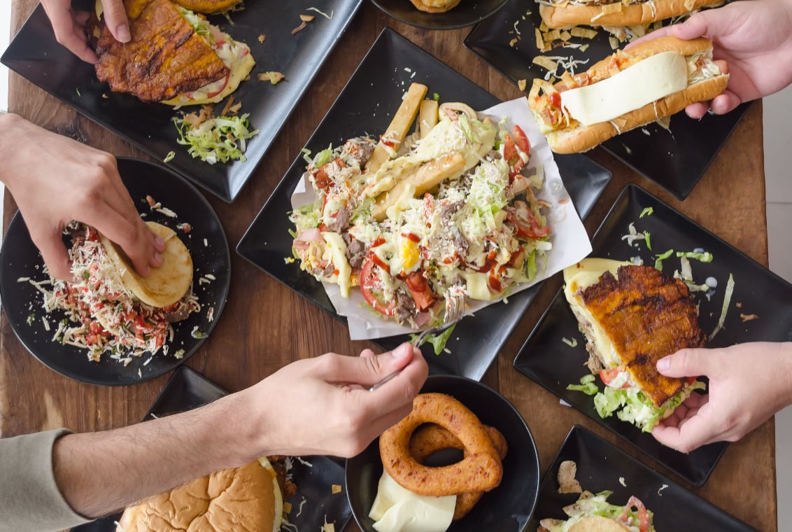 Person Holding Bread With Vegetable Salad
