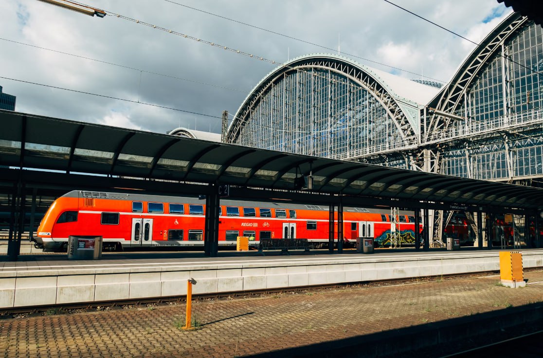 Red And White Train On Rail Tracks