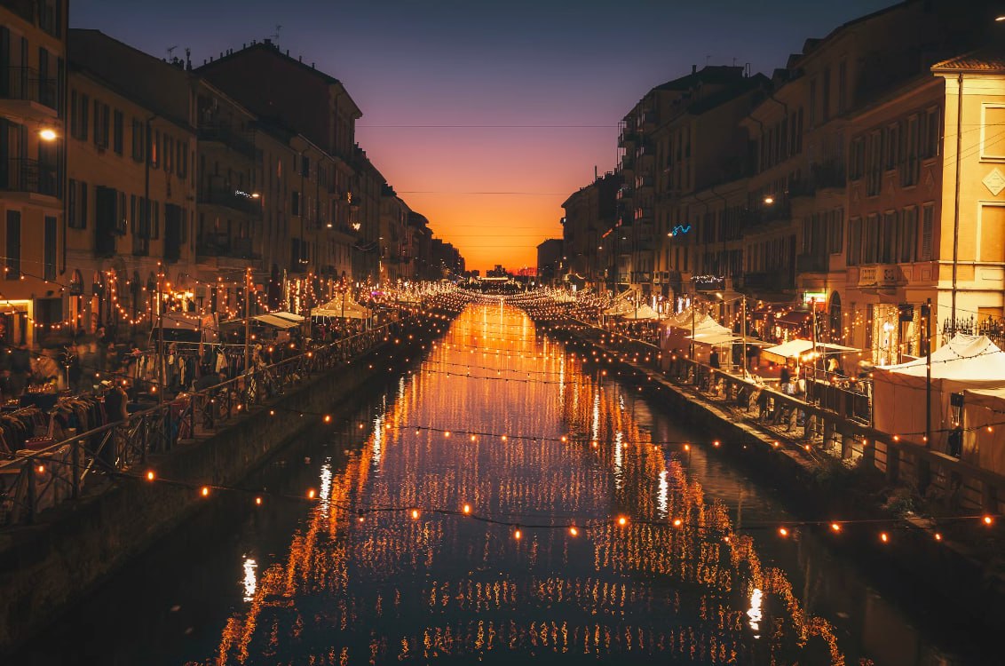 Reflective Photography Of String Lights Above River Taxi