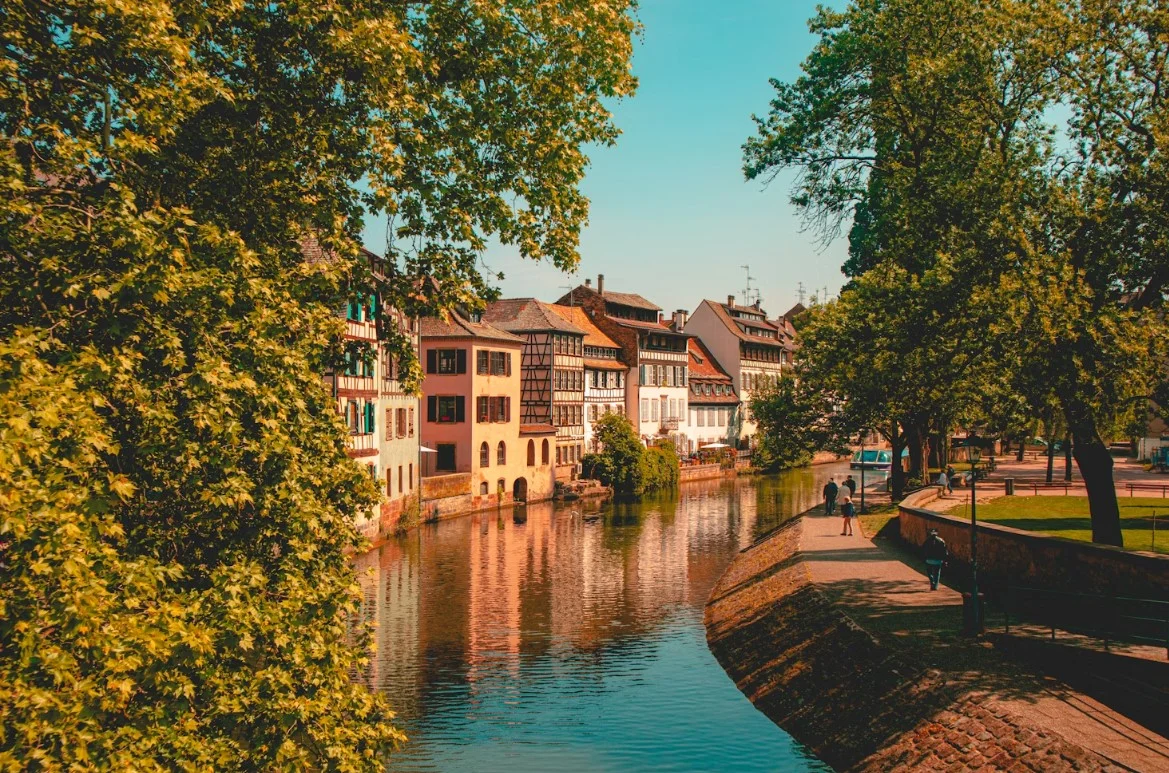 strasbourg-brown-and-white-concrete-building-near-body-of-water-during-daytime