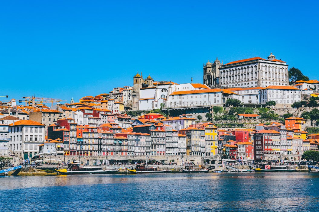White Buildings Near Body Of Water