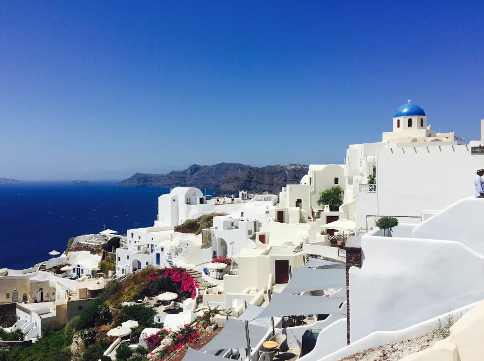 White Concrete Buildings Under Blue Sky