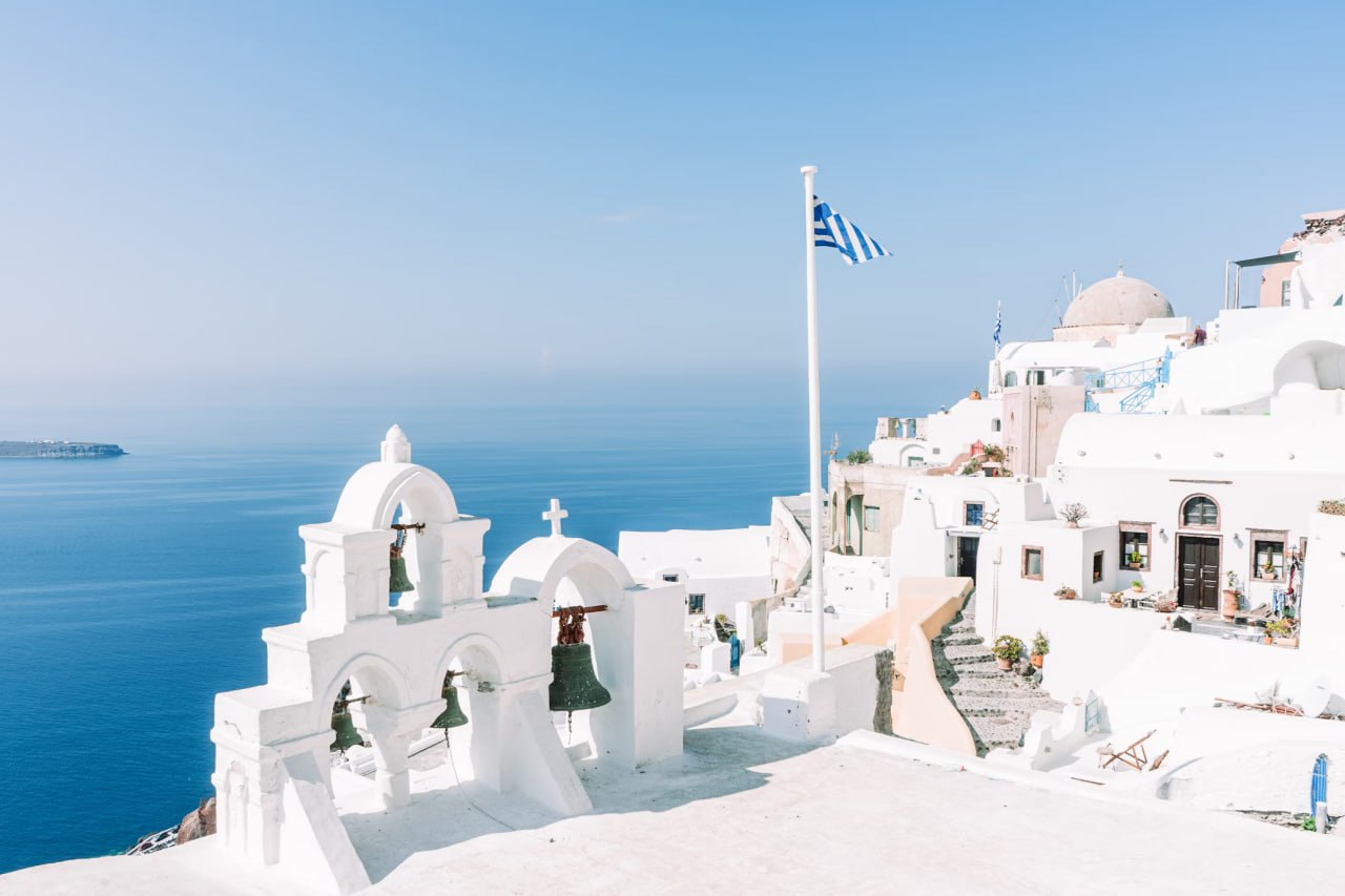 white_concrete_building_near_body_of_water_during_daytime