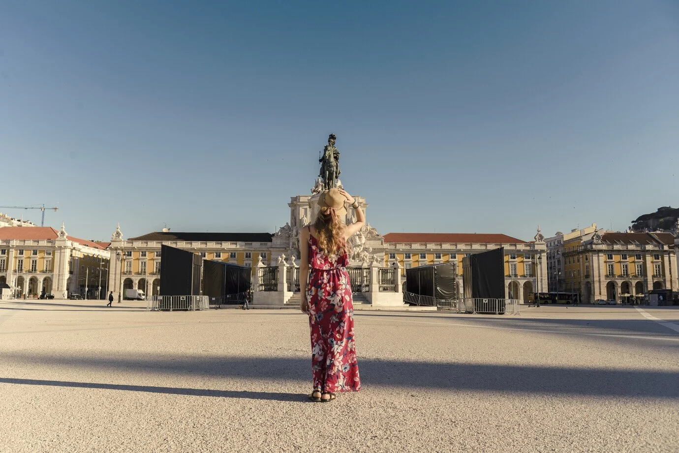 young_female_floral_dress_walking_around_commerce_square_lisbon